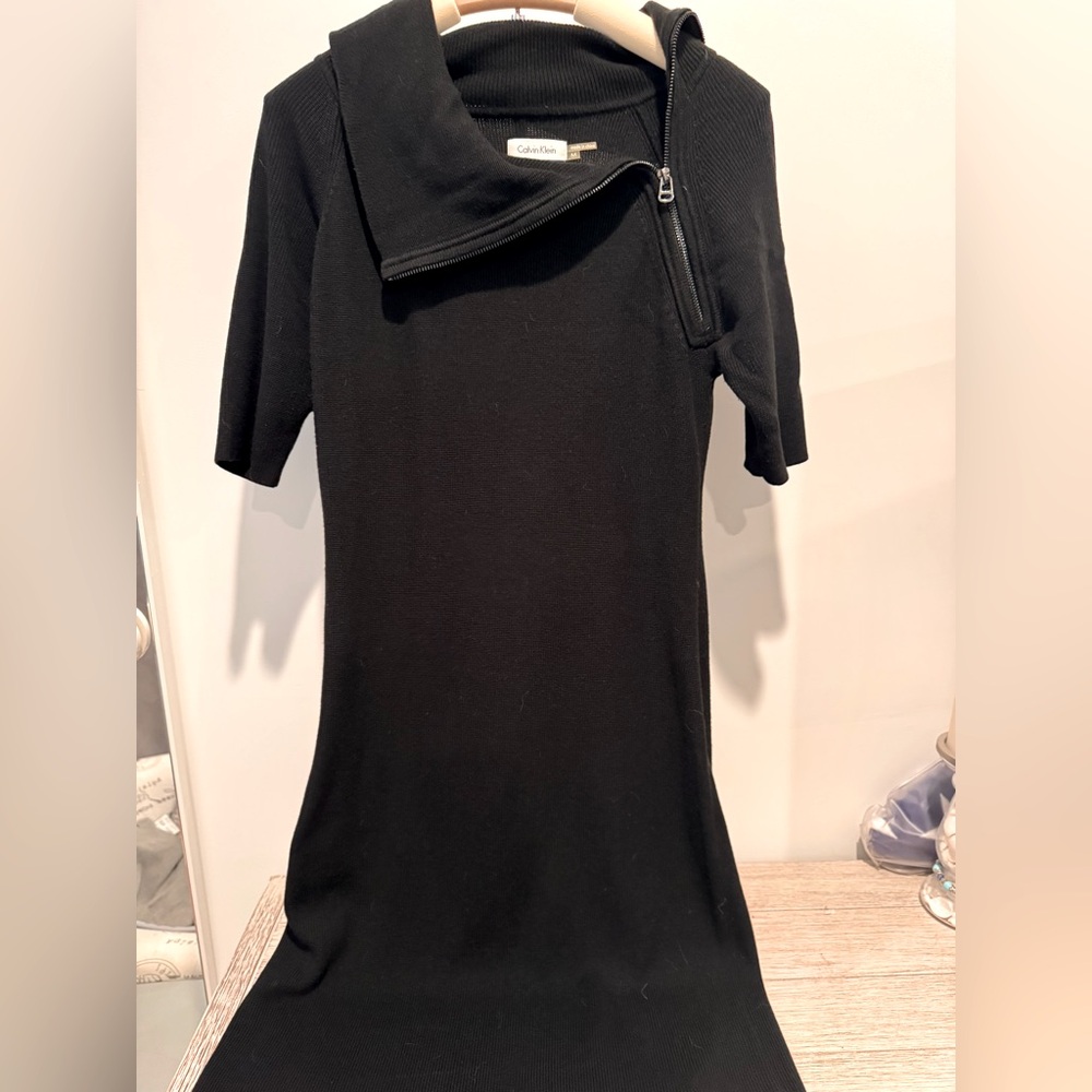 Calvin Klein black sweater dress with zipper detail.